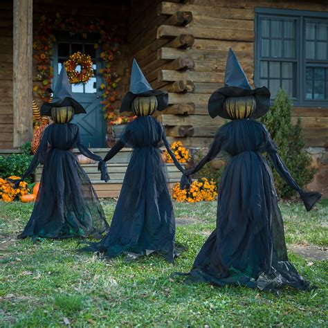 Make Your Halloween Spellbinding with a Witch Figurine Holding Stakes